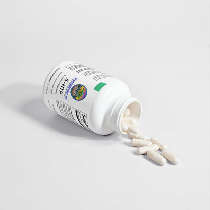 A Healthy8Always 5-HTP bottle lies on its side, capsules spilling out. The white bottle with labeled text and a logo suggests enhanced emotional well-being by boosting serotonin. The background is plain and light-colored.